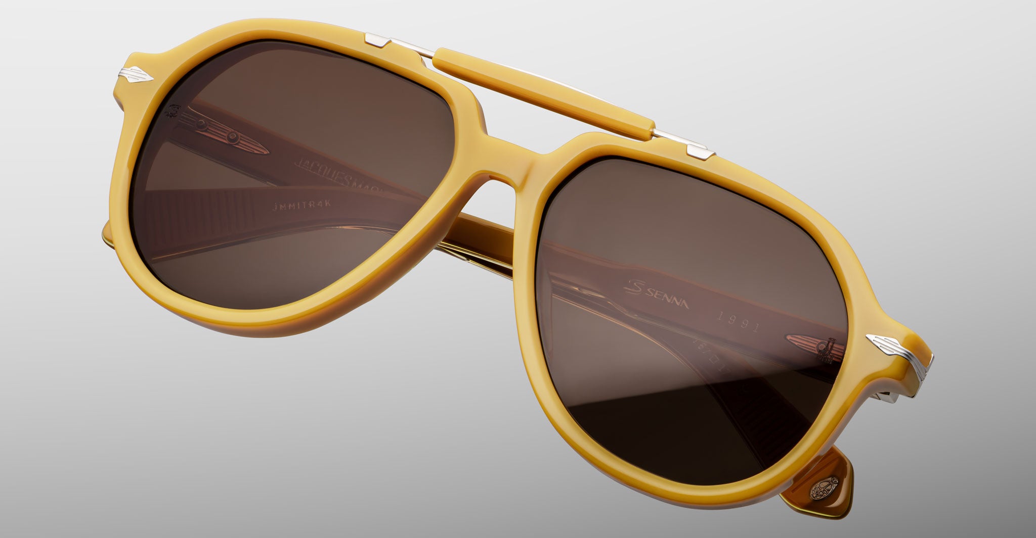 Jacques Marie Mage 1991 aviator sunglasses in yellow with brown lenses and metal accents, front view.