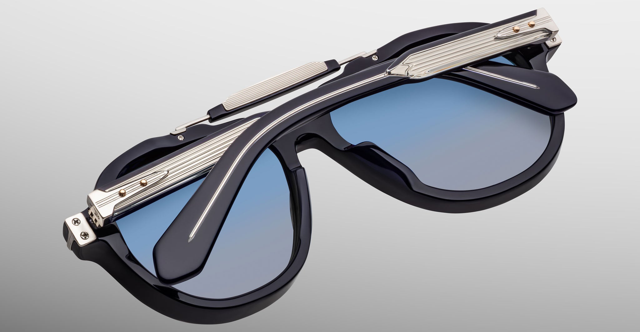 Jacques Marie Mage 1991 sunglasses with polarized blue lenses, black and silver frames, shown from the front.