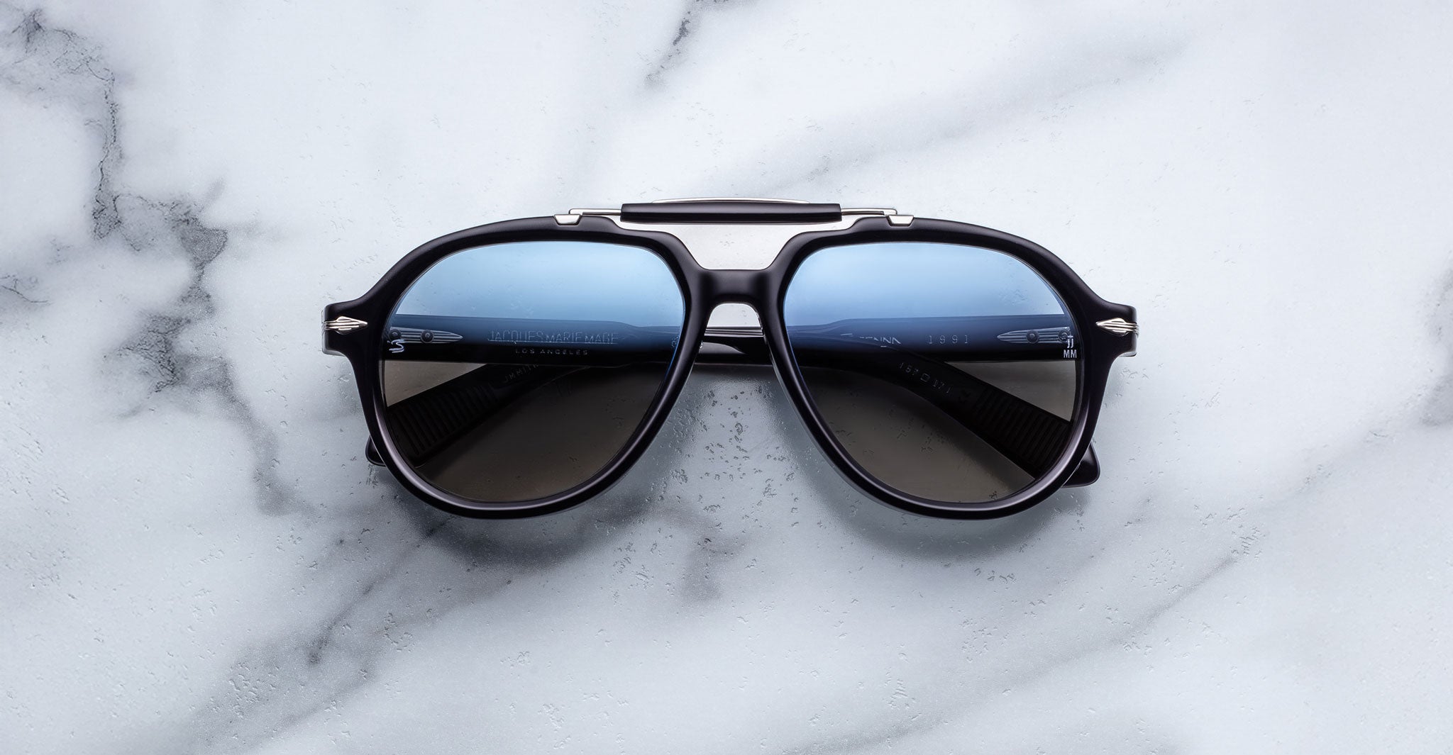 Jacques Marie Mage 1991 sunglasses with blue-tinted lenses, front view.