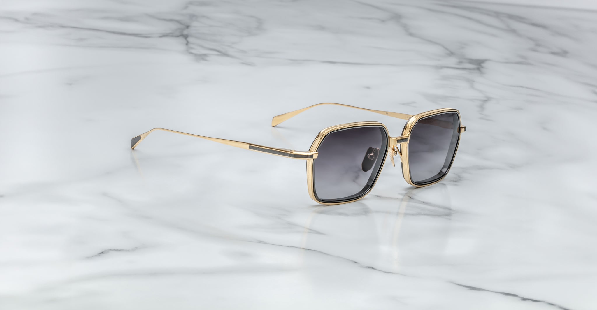 Jacques Marie Mage Admiral gold-framed square sunglasses with UV-protection lenses, top view.