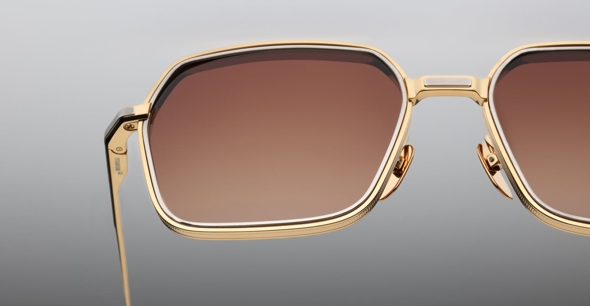 Jacques Marie Mage Admiral sunglasses with gold frames and large square brown gradient lenses, front view.