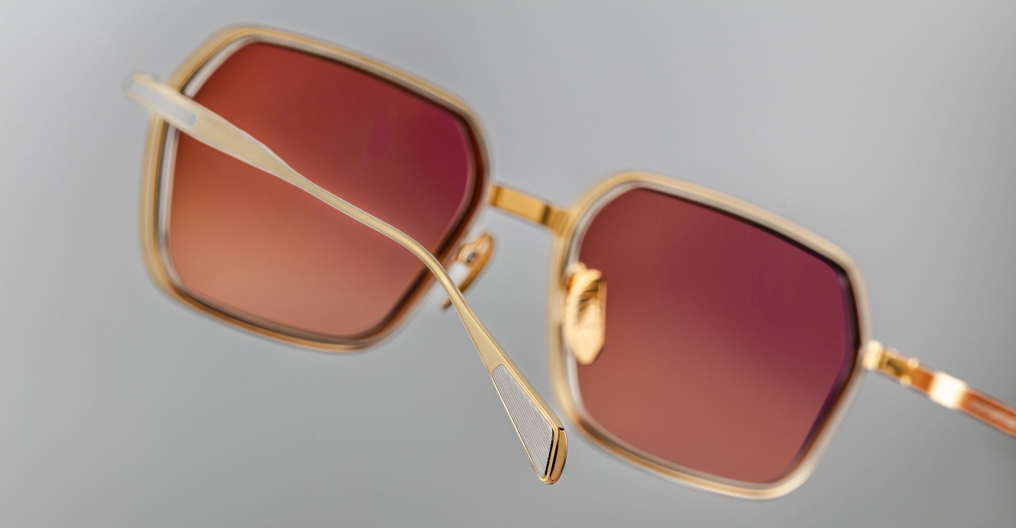 Jacques Marie Mage Admiral gold square sunglasses with reddish-brown lenses, shown in a close-up front-facing view.
