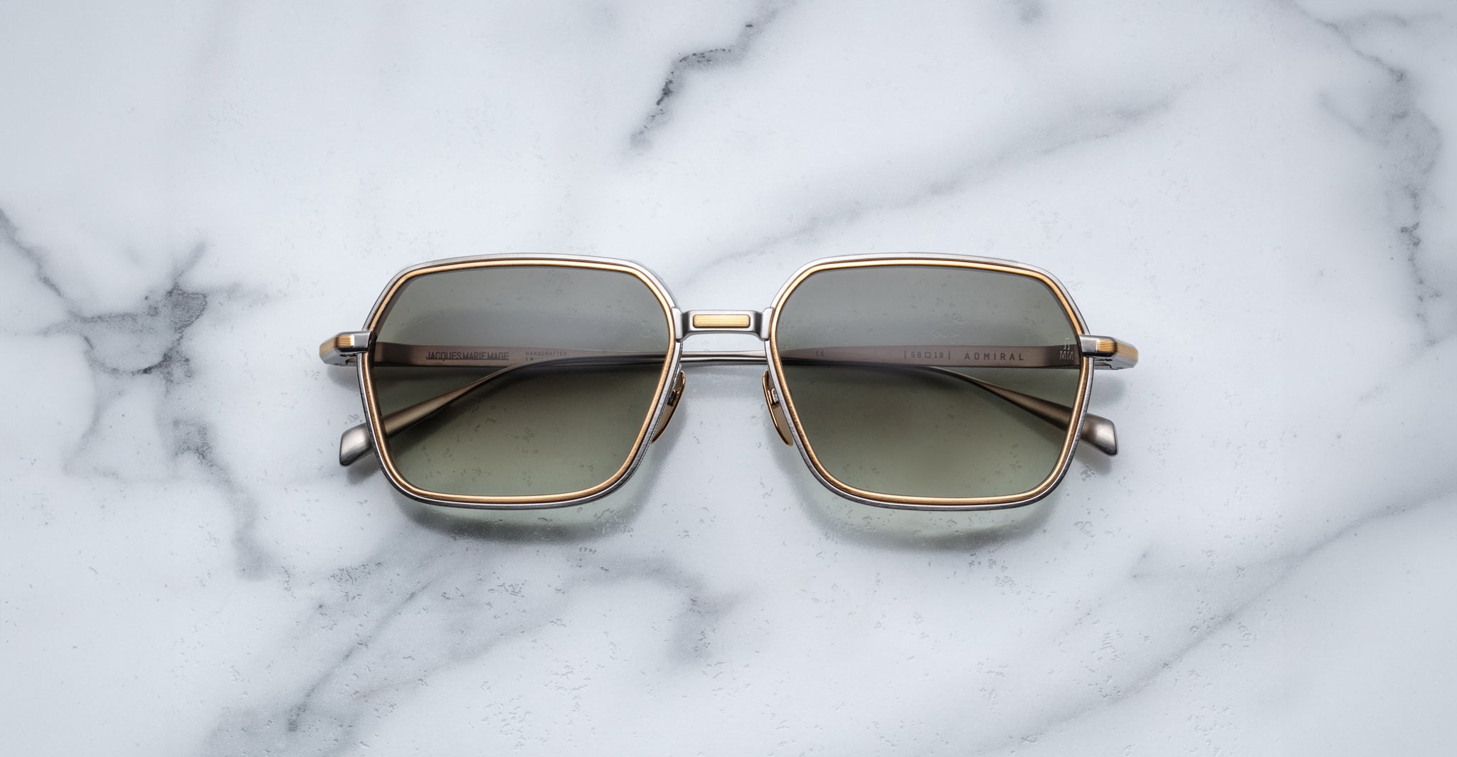 Jacques Marie Mage Admiral sunglasses with gold frames and lenses, top view.