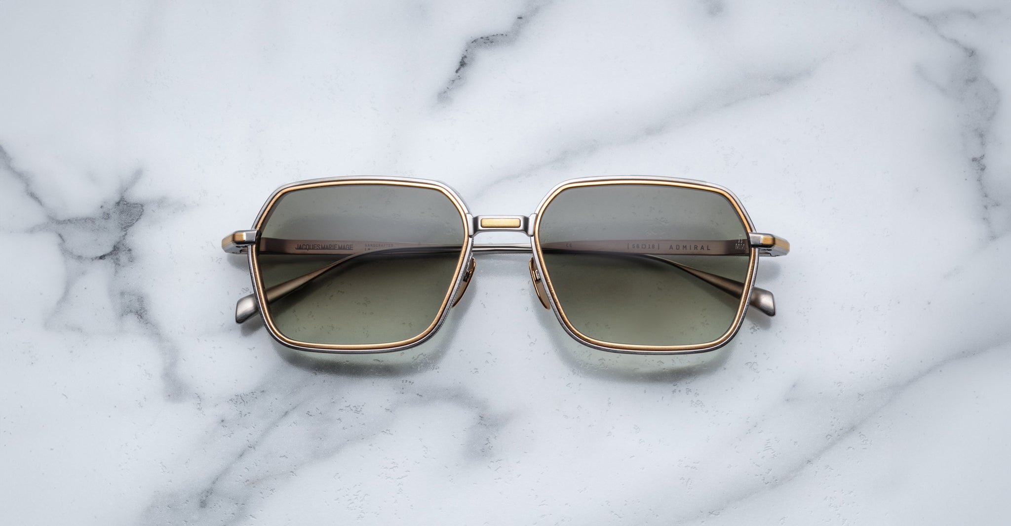 Jacques Marie Mage Admiral sunglasses with gold frames and lenses, top view.