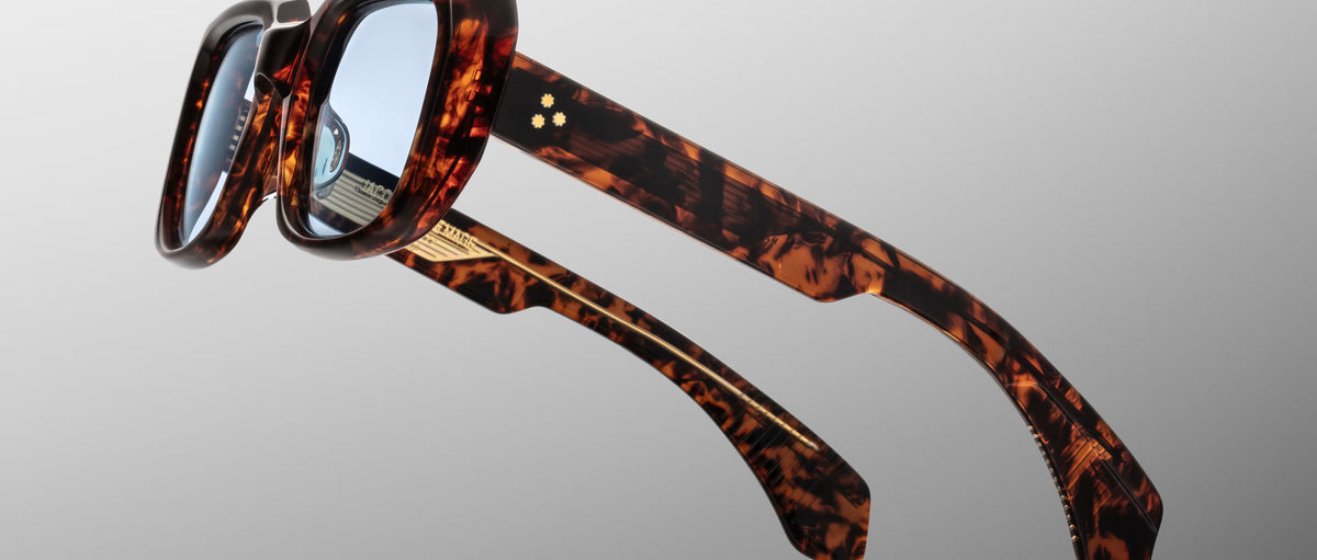 Jacques Marie Mage Aldo thick brown tortoiseshell sunglasses with blue lenses shown from the front.