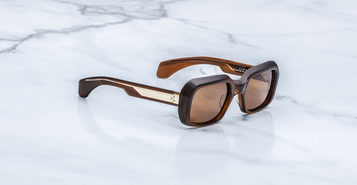 Jacques Marie Mage Aldo brown square sunglasses with UV lenses and gold accents, top view.