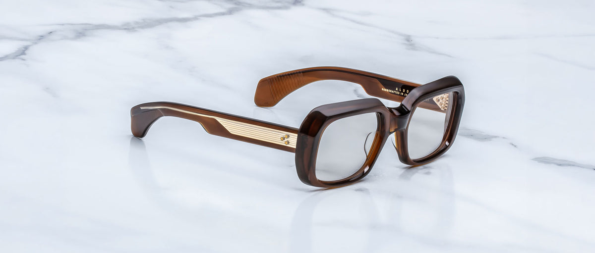 Jacques Marie Mage Aldo brown oversized square eyeglasses with gold temples, top view.