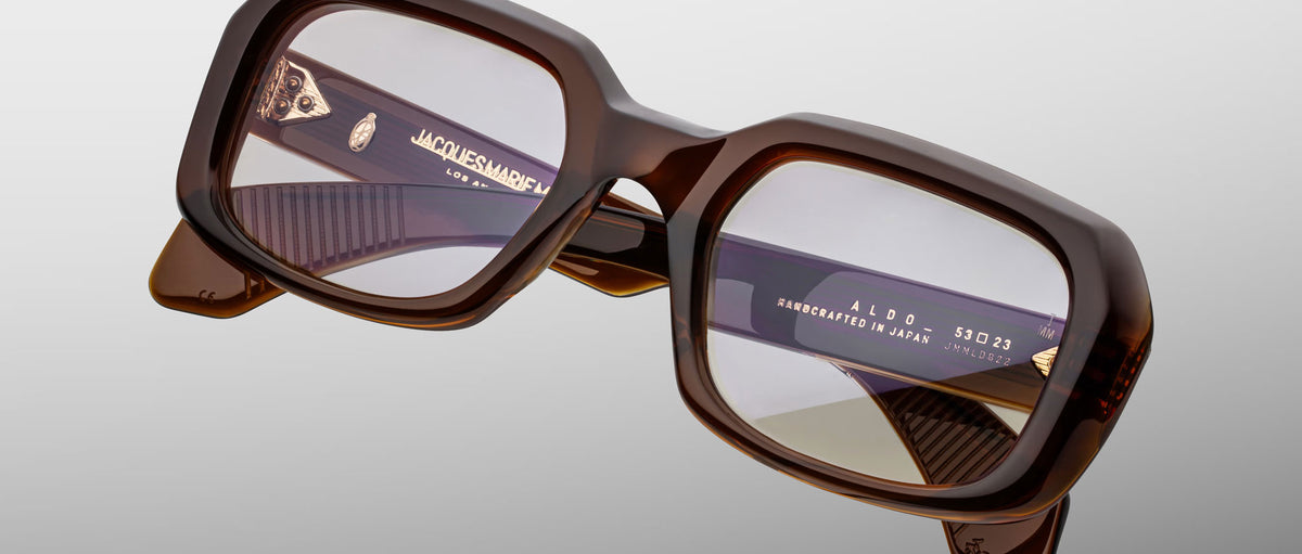 Jacques Marie Mage Aldo brown oversized square eyeglasses with clear lenses, front and side frame details visible.