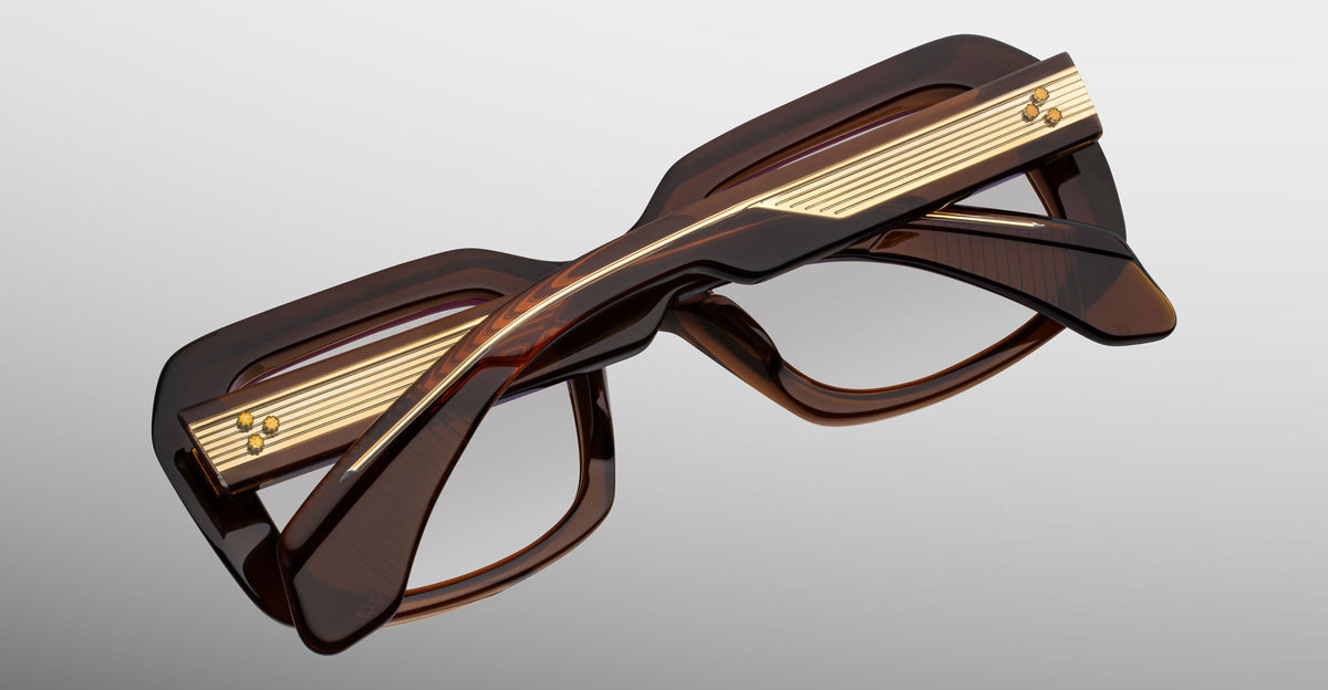 Jacques Marie Mage Aldo eyeglasses, thick brown rectangular frames with gold accents and bold temples, top view.
