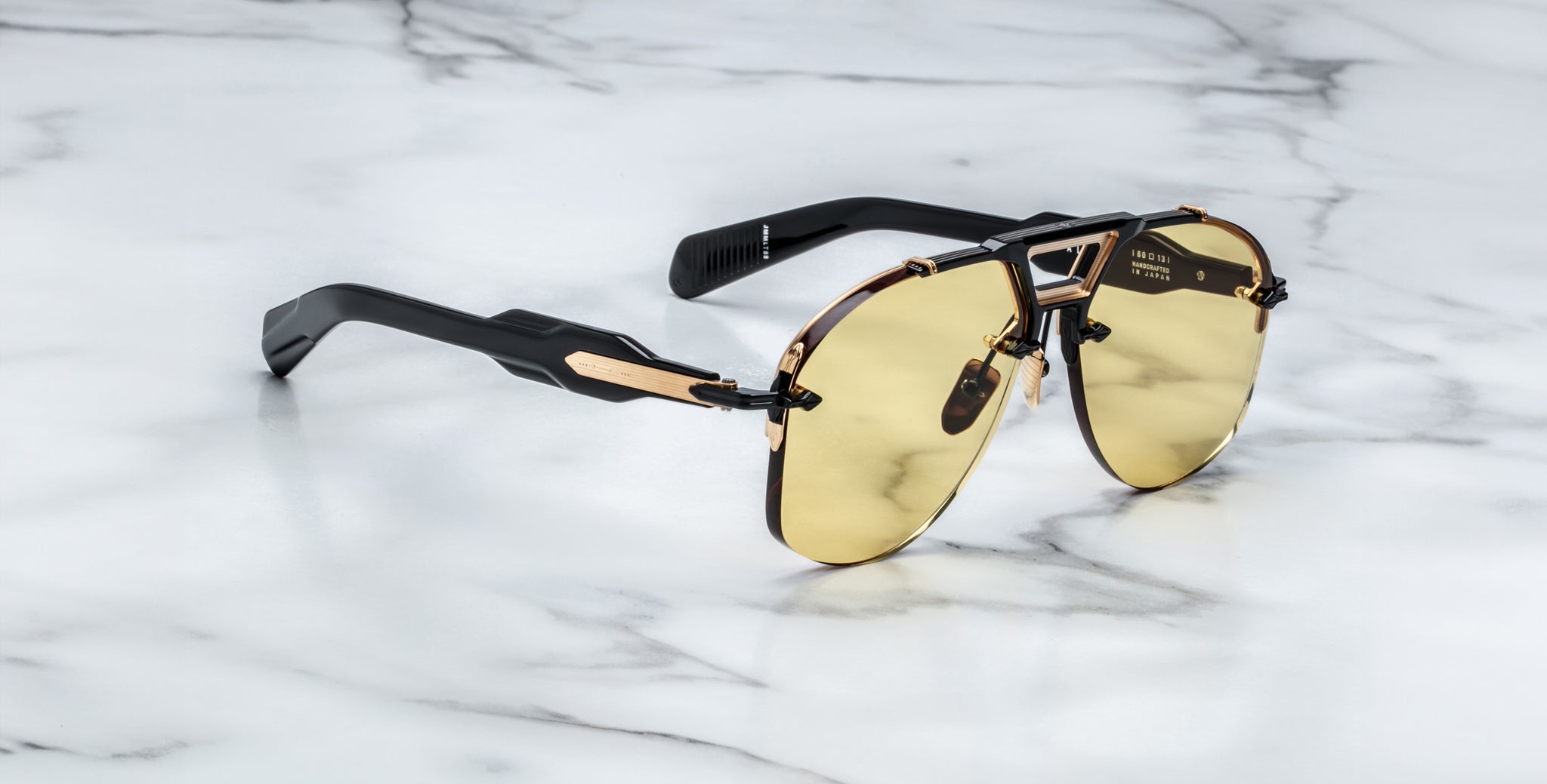 Jacques Marie Mage Alta aviator sunglasses, gold lenses, black-gold frames, front view.
