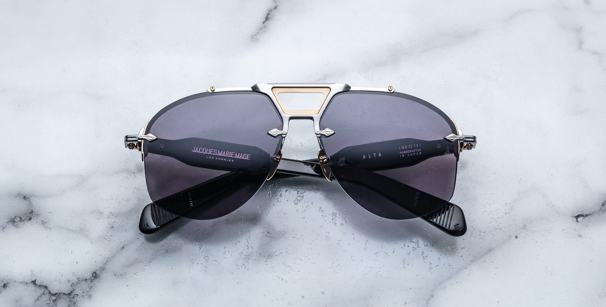 Jacques Marie Mage Alta black aviator sunglasses with gold accents, top view showing full frame and bridge details.