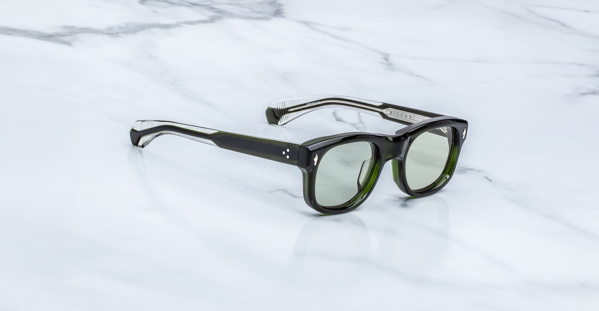 Jacques Marie Mage Amilcar sunglasses with green lenses, front view.