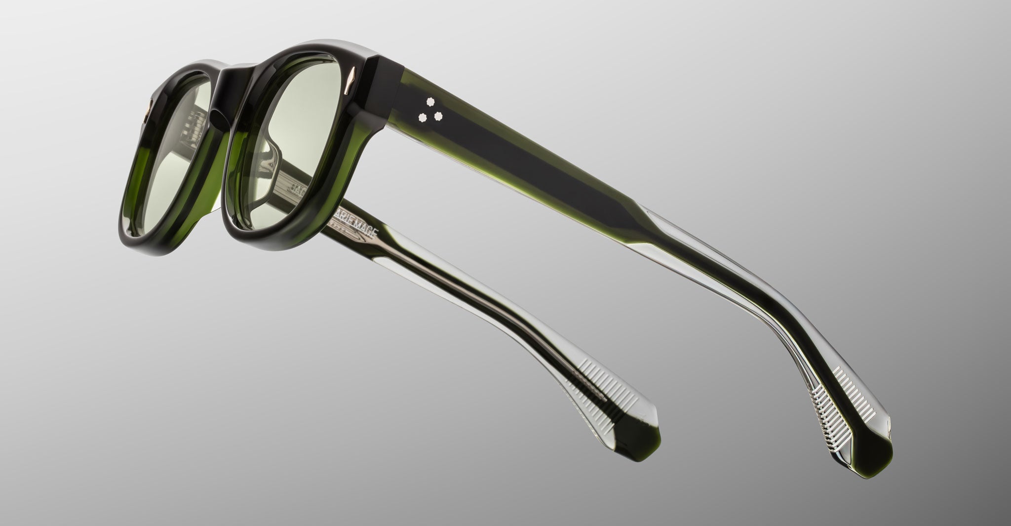 Jacques Marie Mage Amilcar eyeglasses, rectangular green and black thick frames, shown from the rear angle.
