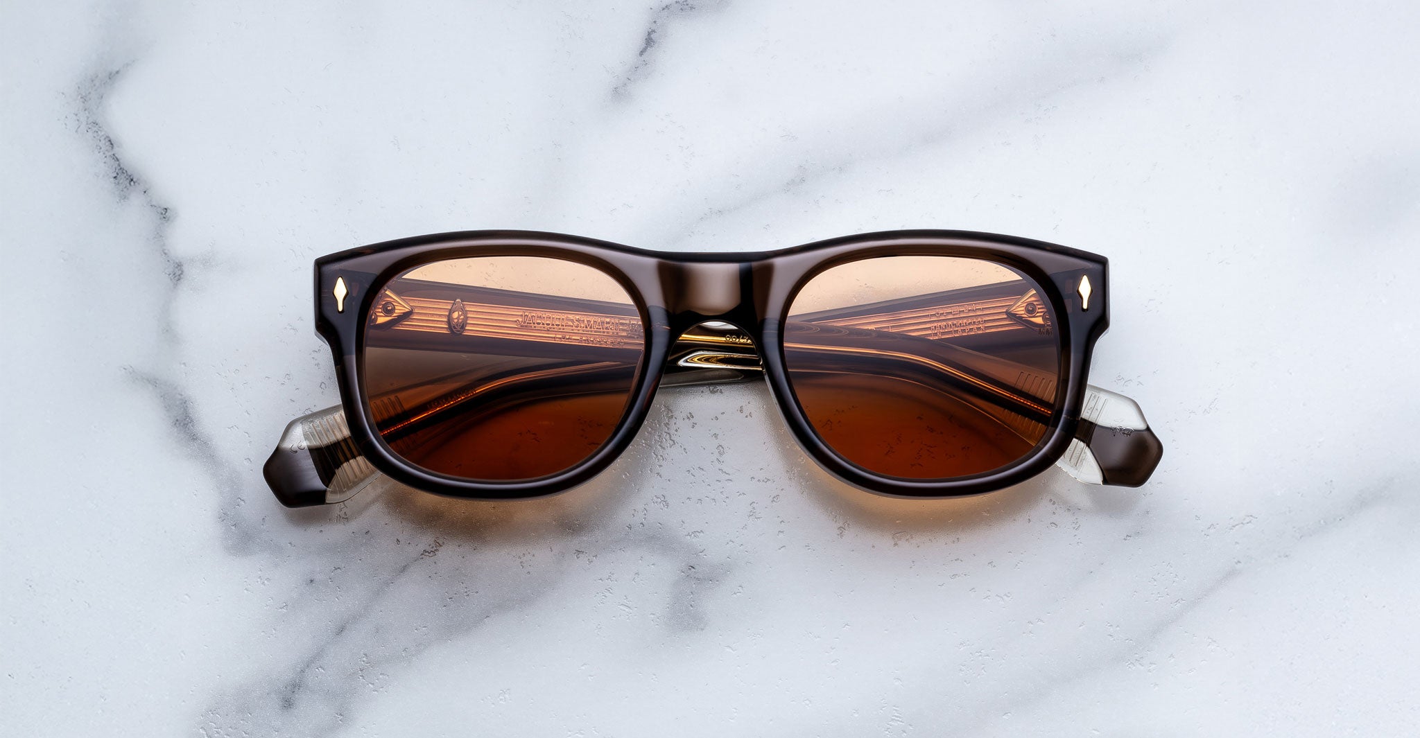 Jacques Marie Mage Amilcar sunglasses with amber lenses, front view.