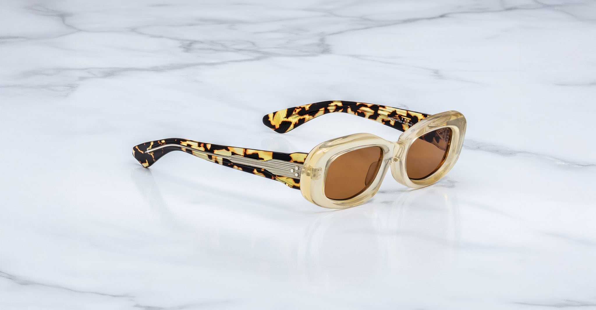 Jacques Marie Mage Ann in Dune, side angle view highlighting patterned temples and engraved wirecore detail