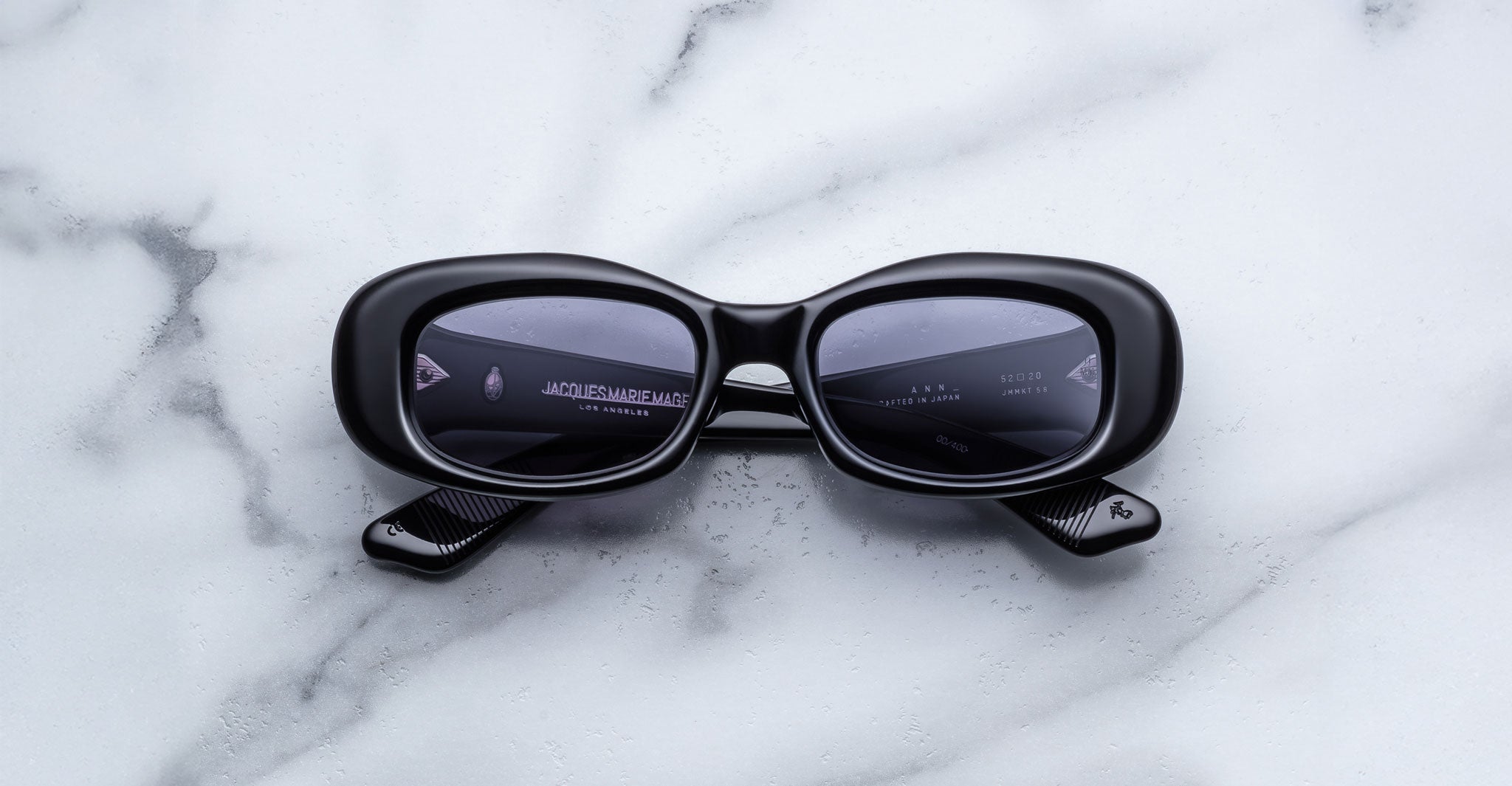 Jacques Marie Mage Ann in Raven black, front view with rectangular lenses and bold sculptural acetate frame