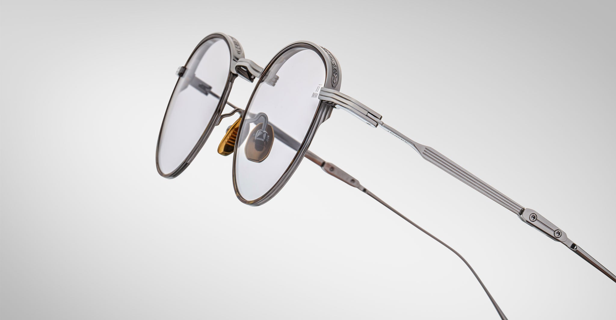 Detailed view of the side of the Jacques Marie Mage Archibald Sunglass in Silver Colorway