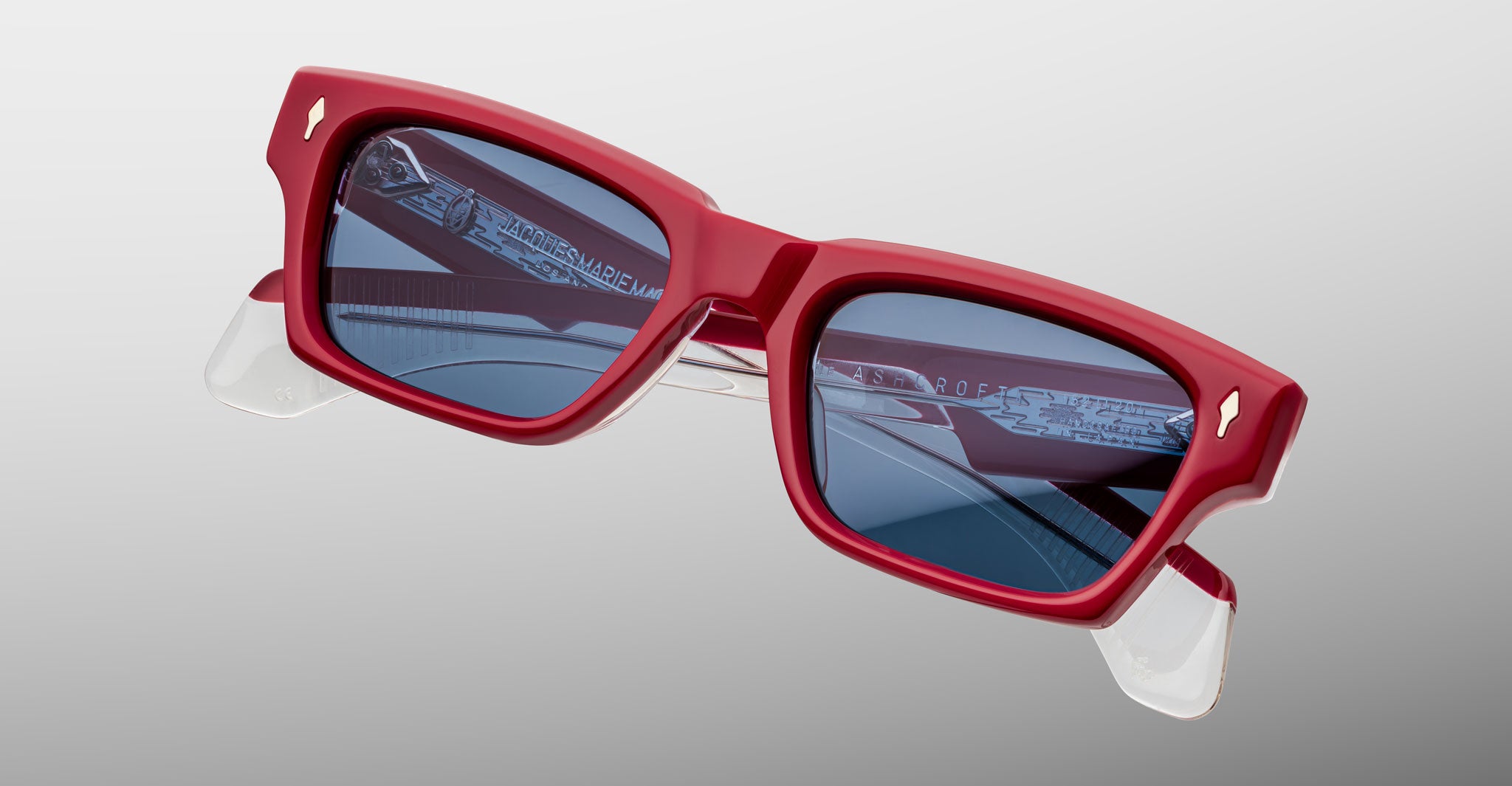 Jacques Marie Mage Ashcroft in Pirate acetate featuring a bold rectangular frame, signature arrowhead front pins, sculpted temples, and blue tinted lenses