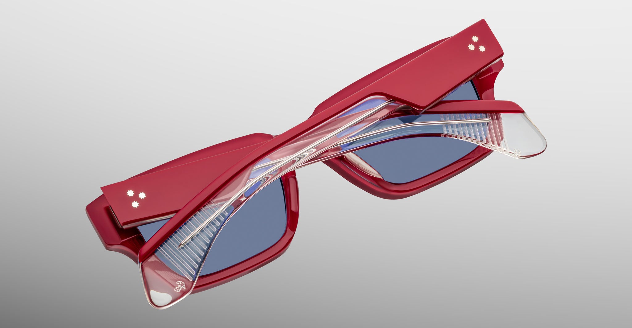 Jacques Marie Mage Ashcroft in Pirate acetate featuring a bold rectangular frame, triple dot temple details, exposed wirecore temples, sculpted temple tips, and blue tinted lenses