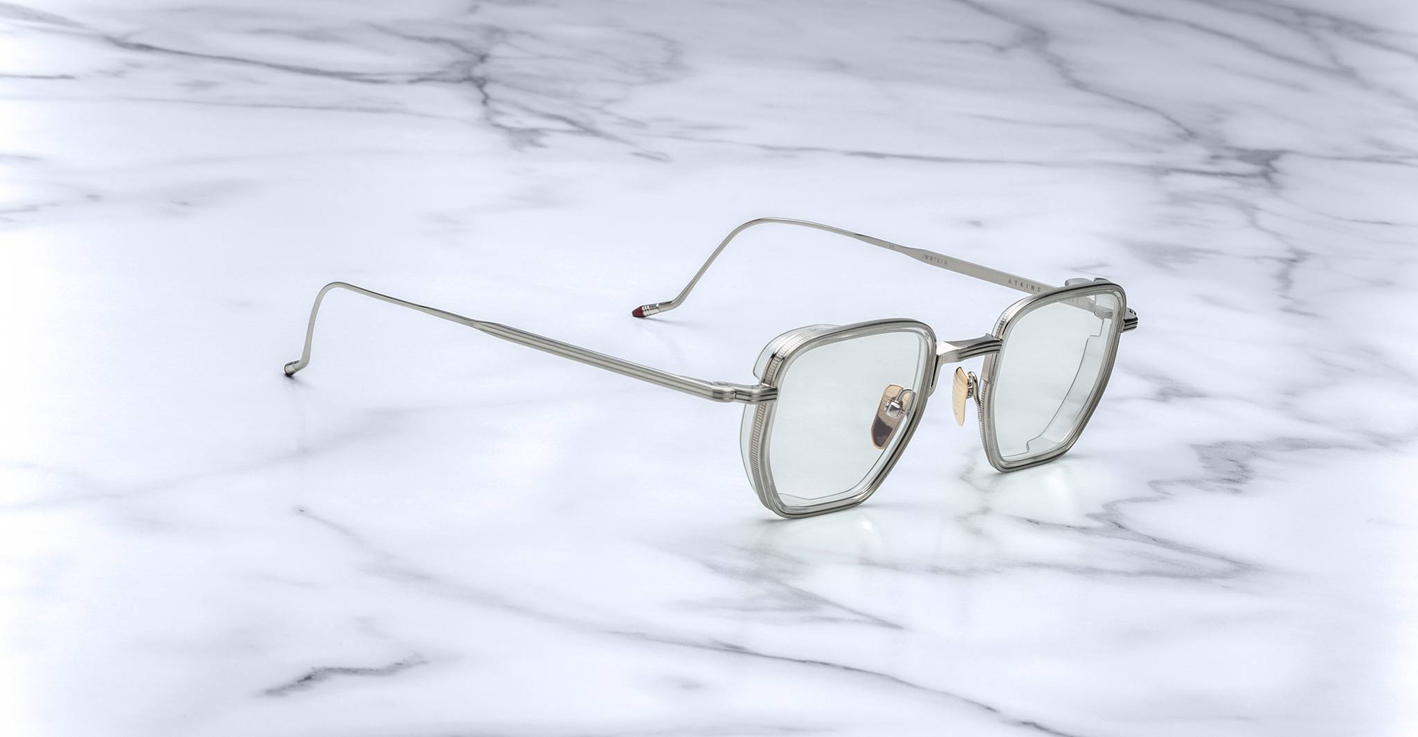 Jacques Marie Mage Atkins square silver eyeglasses with clear lenses, top-down view.