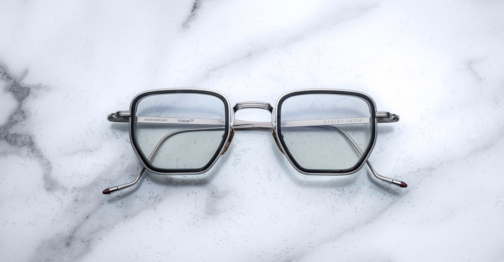 Jacques Marie Mage Atkins eyeglasses, silver frames, clear lenses, front angle view.