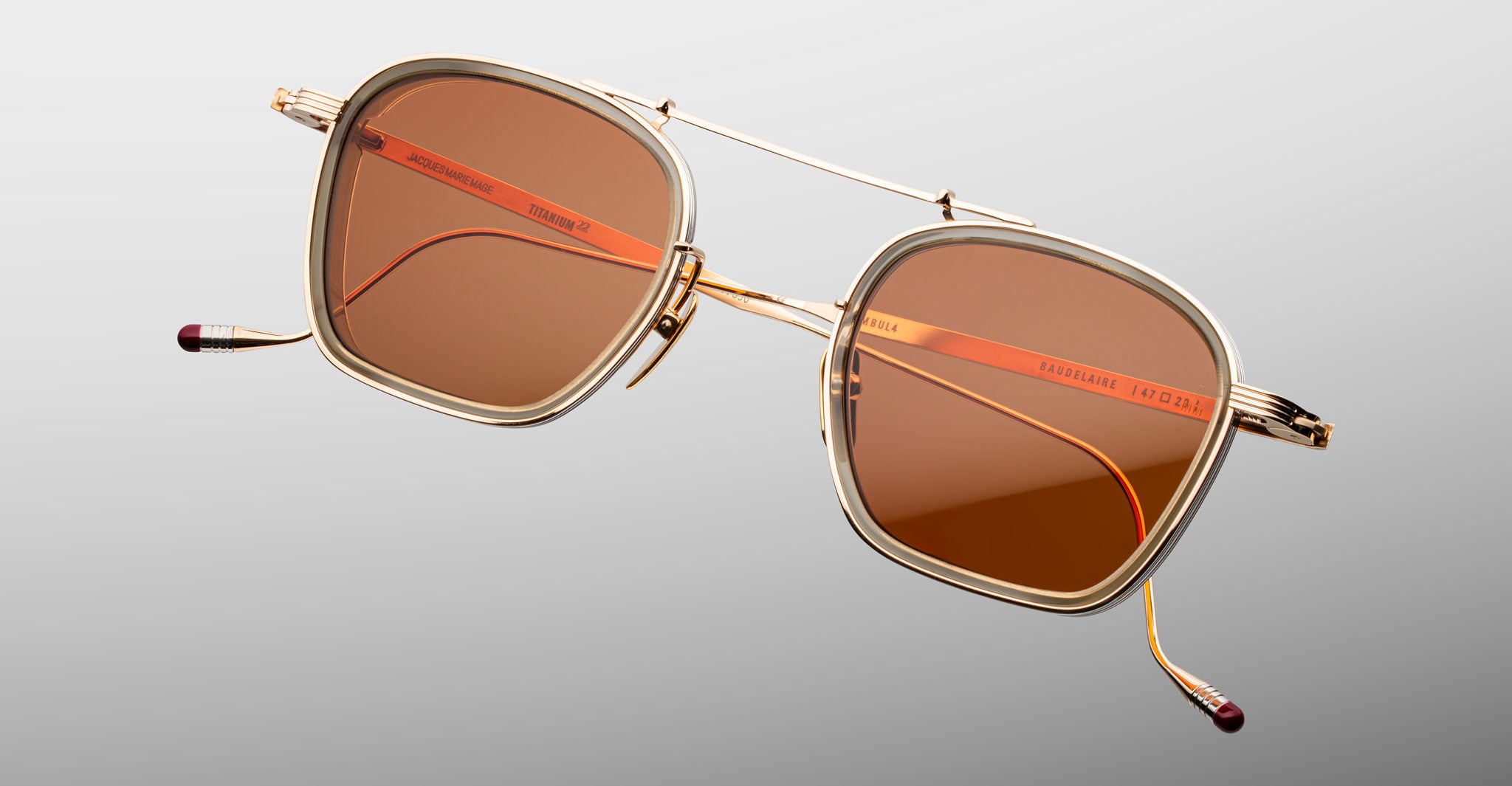 Jacques Marie Mage Baudelaire 2 gold square polarized sunglasses with brown lenses, front view.