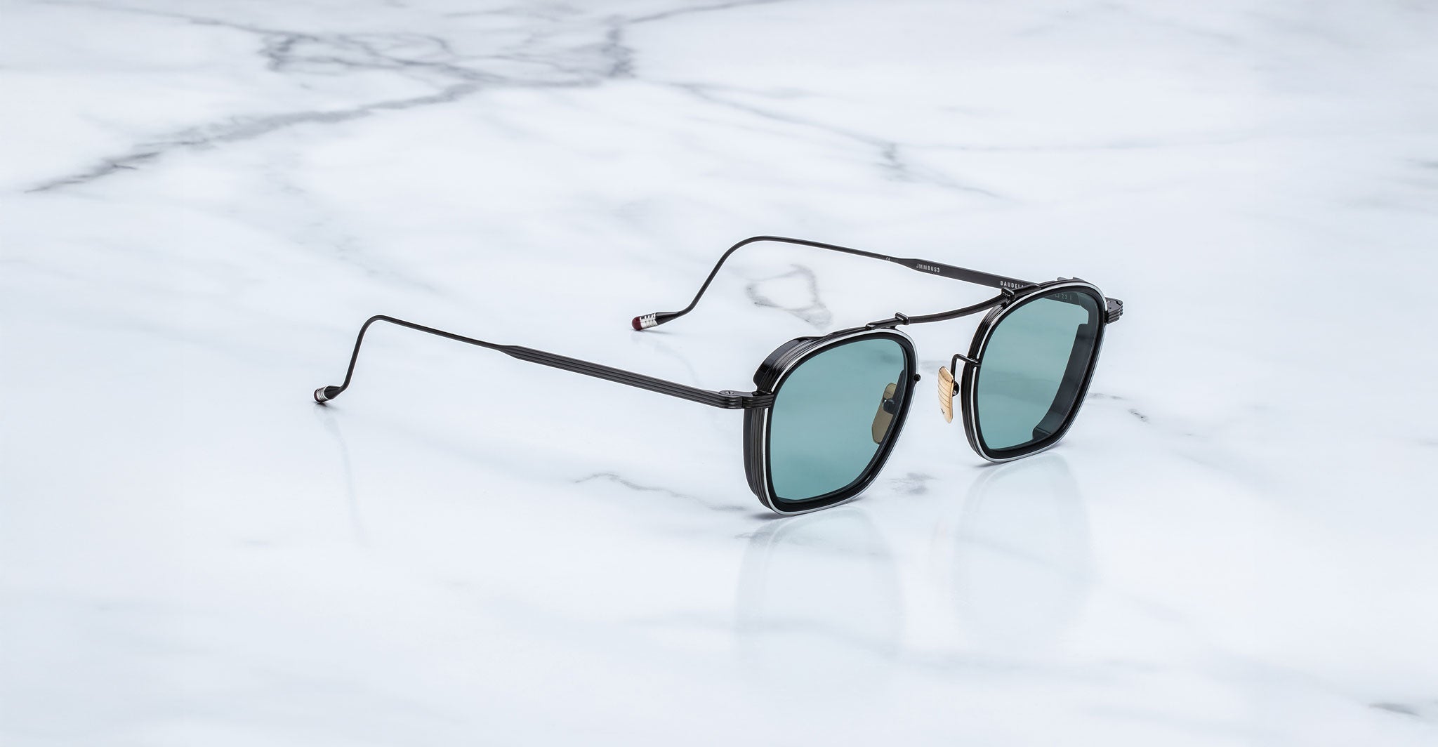 Jacques Marie Mage Baudelaire 2 polarized sunglasses with green lenses shown from above.