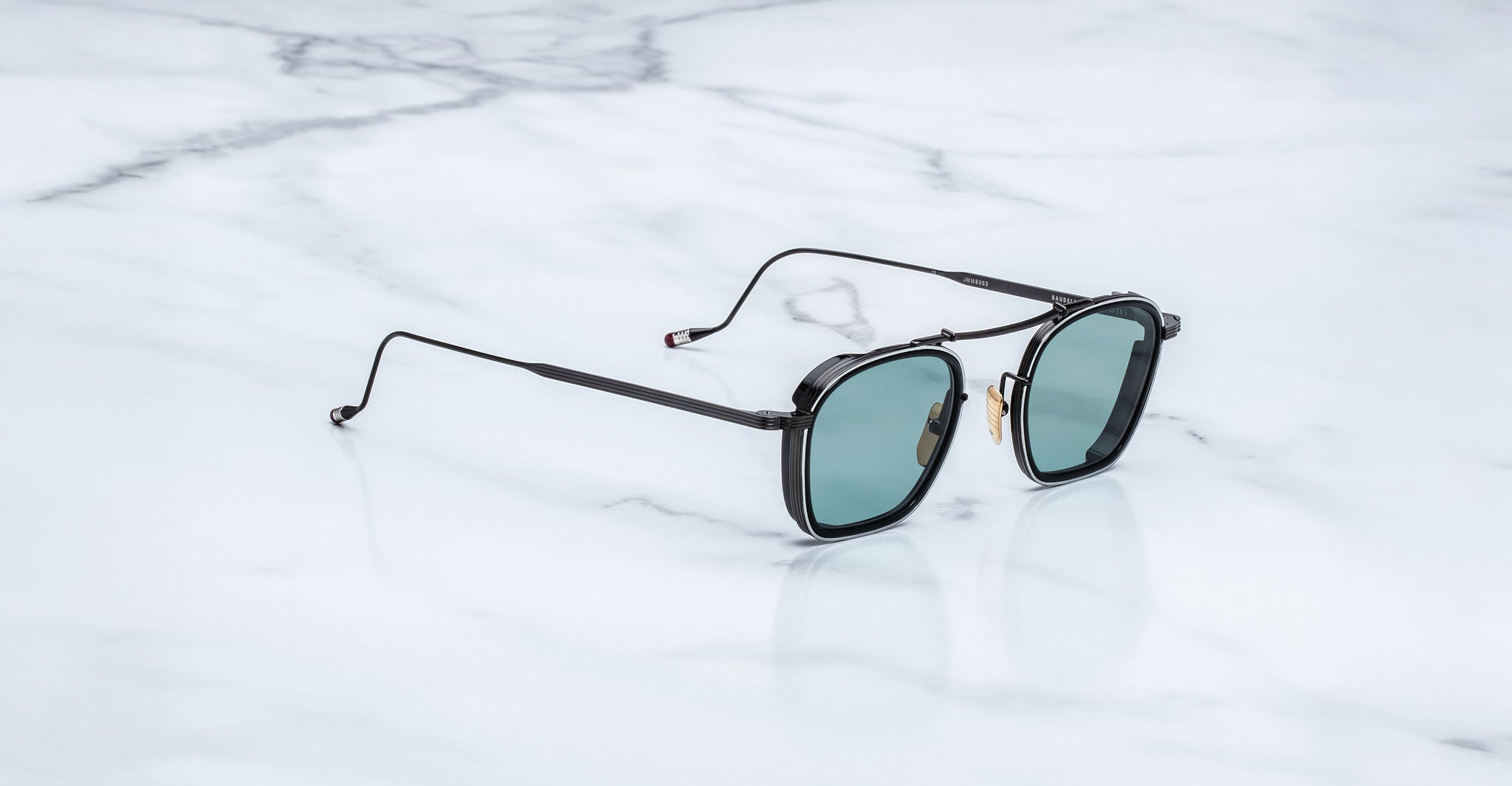 Jacques Marie Mage Baudelaire 2 polarized sunglasses with green lenses shown from above.
