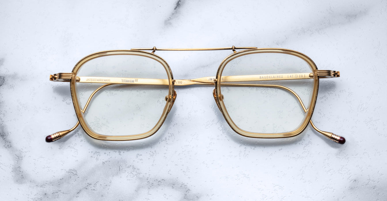Jacques Marie Mage Baudelaire 2 gold rectangular eyeglasses with clear lenses and double bridge, front view.