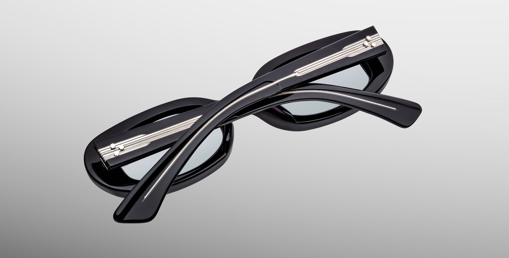 Jacques Marie Mage Besset black sunglasses with crossed temples, product side view.