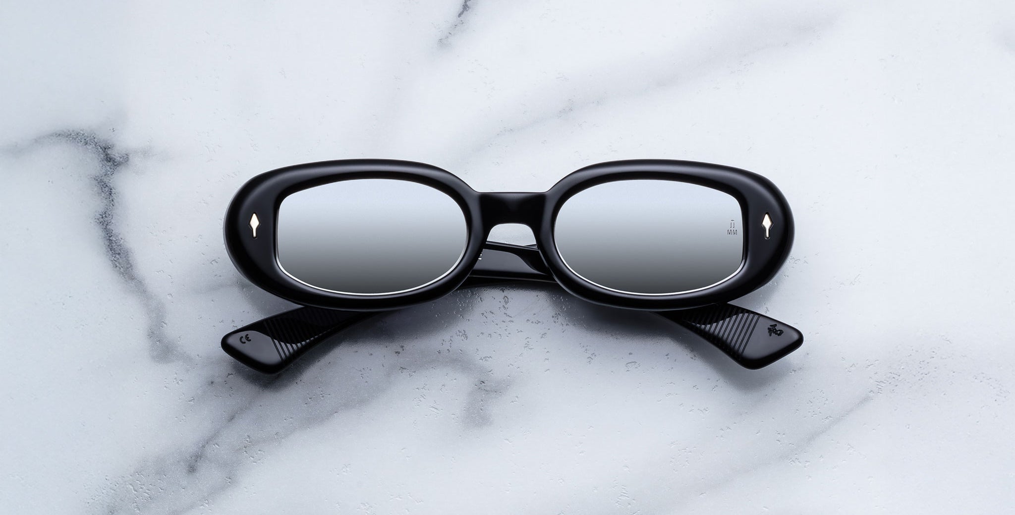 Jacques Marie Mage Besset sunglasses in black with reflective lenses shown front view.