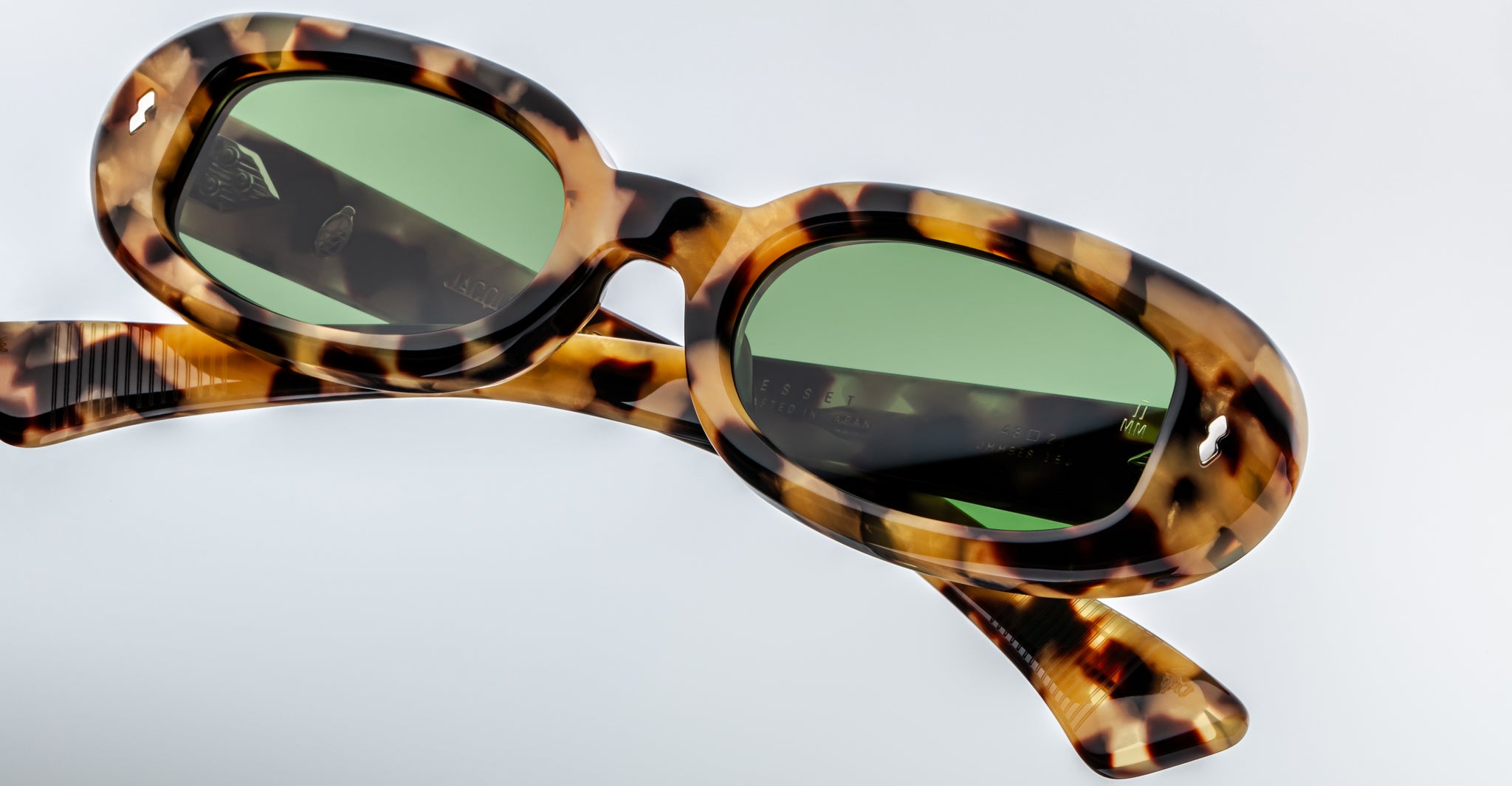 Jacques Marie Mage Besset square tortoiseshell sunglasses with green lenses, front view.