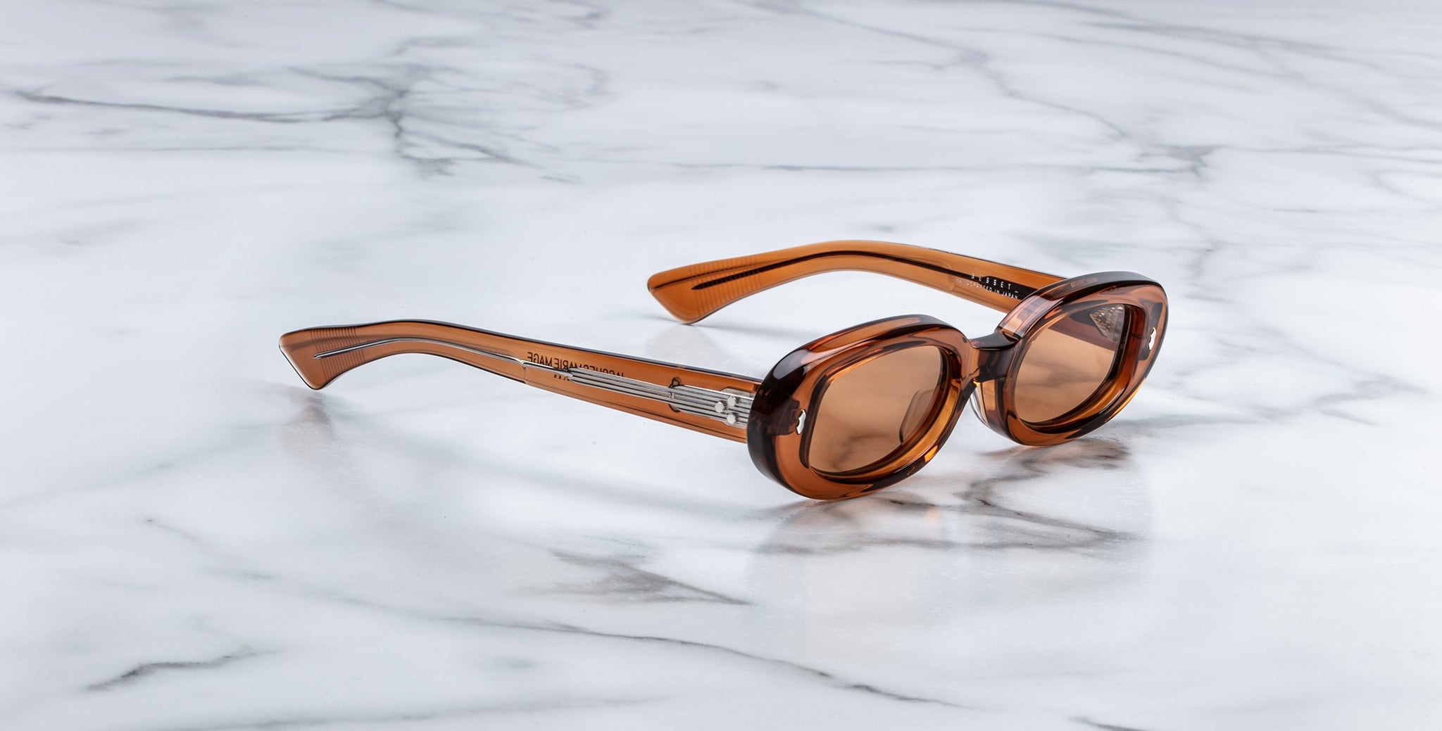 Jacques Marie Mage Besset brown sunglasses with thick frames, top view.