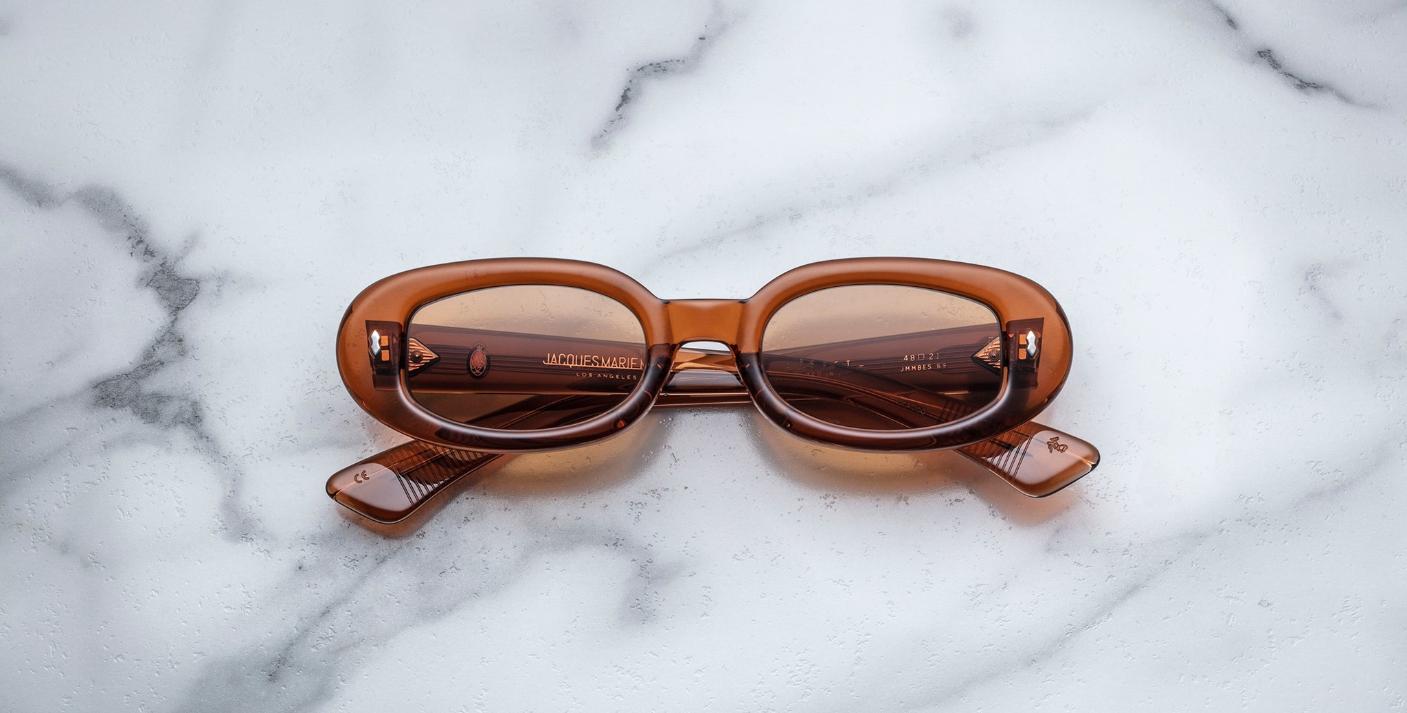 Jacques Marie Mage Besset sunglasses with thick brown rectangular frames, front view.