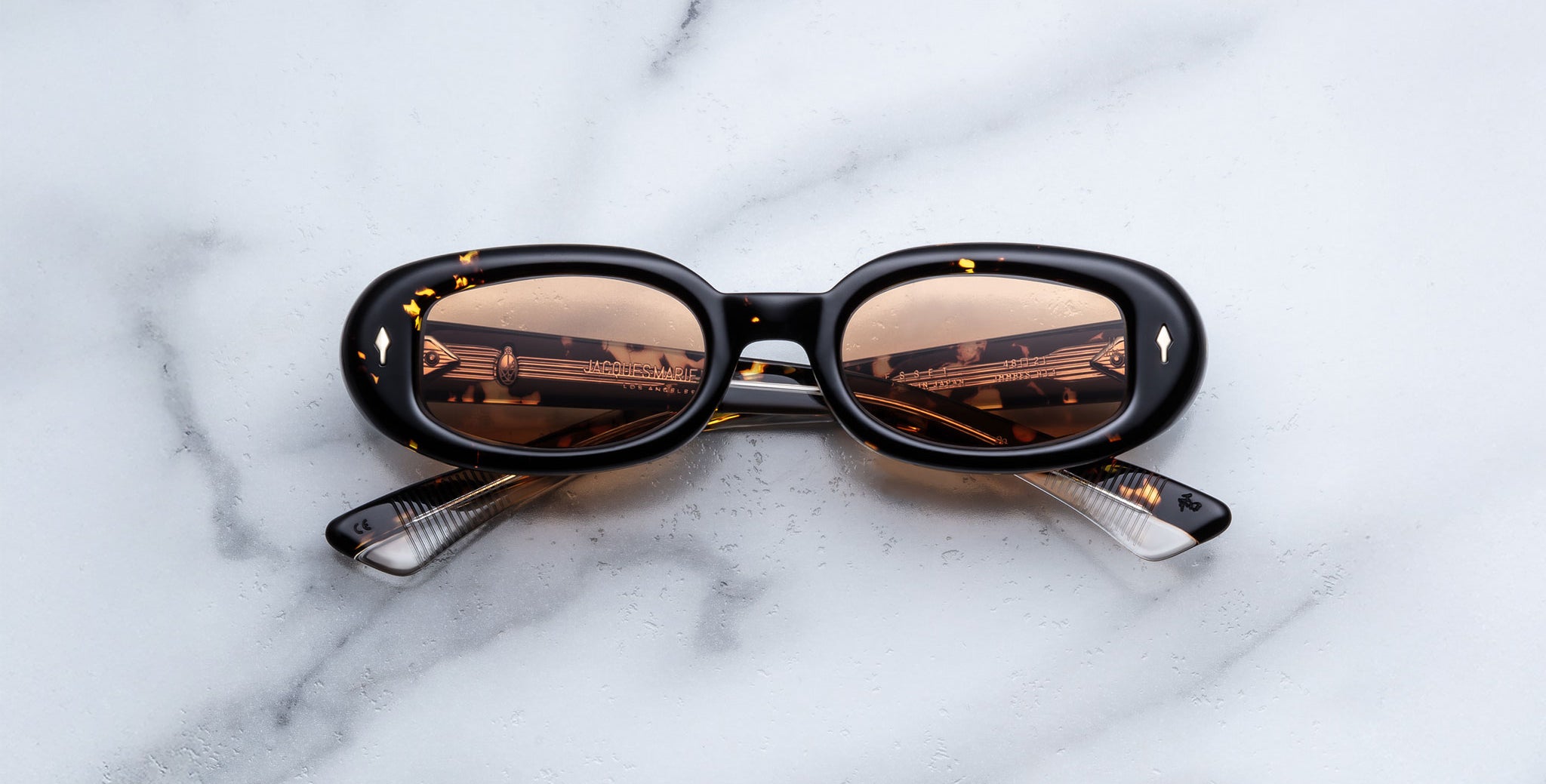 Jacques Marie Mage Besset sunglasses in brown and yellow tortoise shell pattern with orange lenses front view