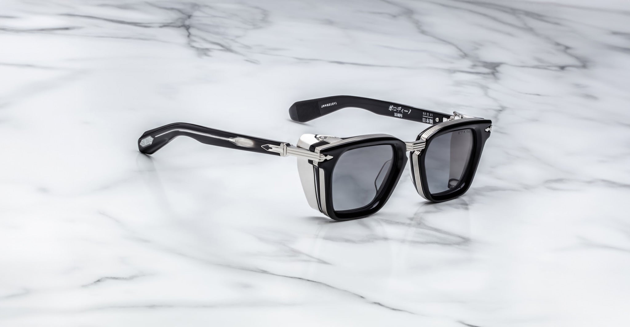 Jacques Marie Mage Borodino black square sunglasses with silver accents and UV protection, top view.