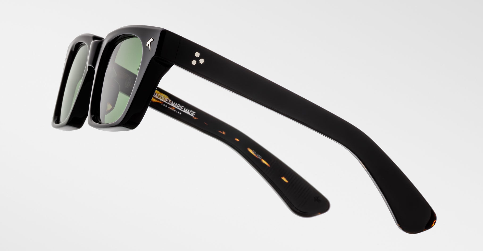 Jacques Marie Mage Quentin black rectangular sunglasses with thick frames, side view.