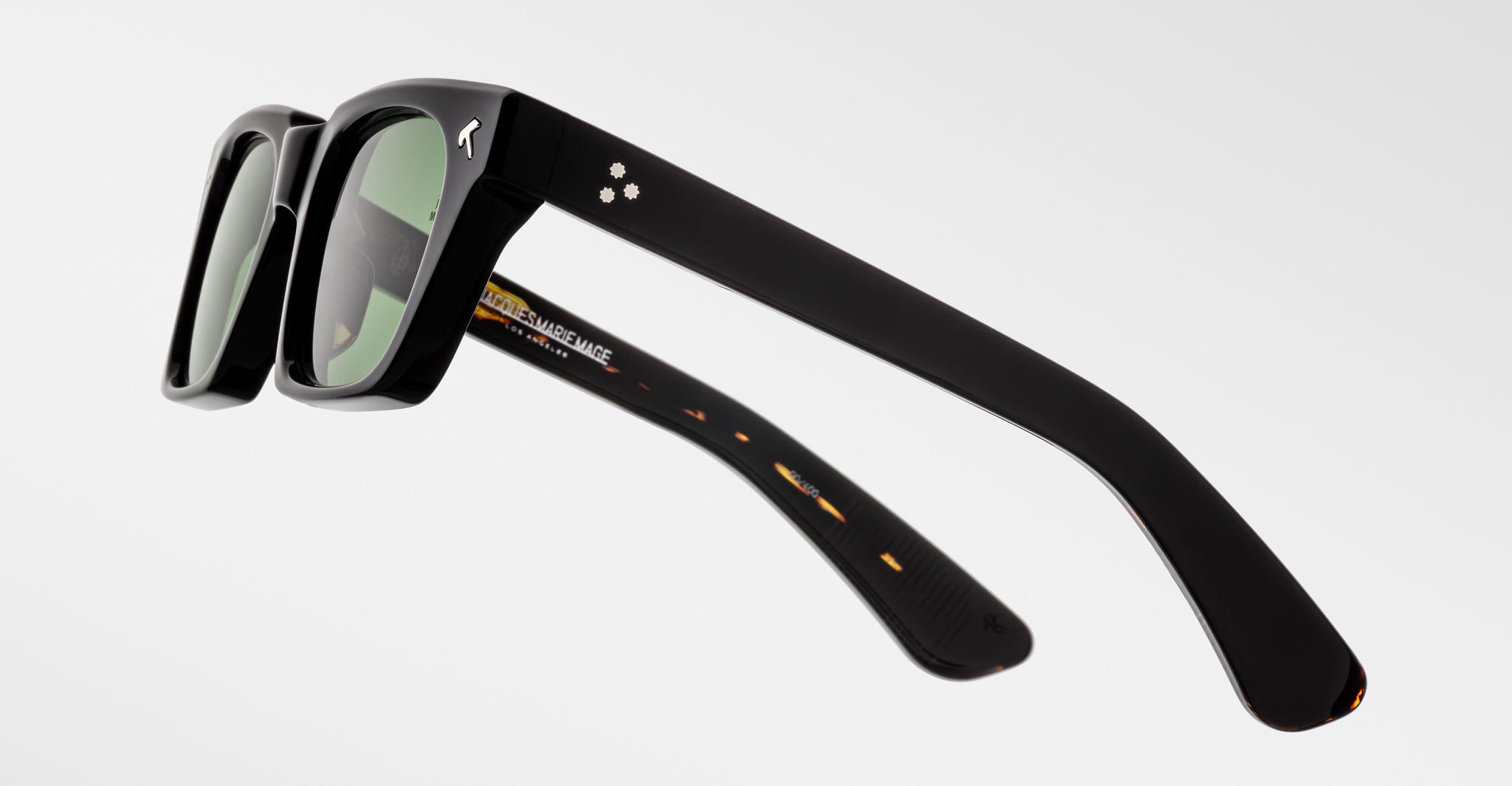 Jacques Marie Mage Quentin black rectangular sunglasses with thick frames, side view.