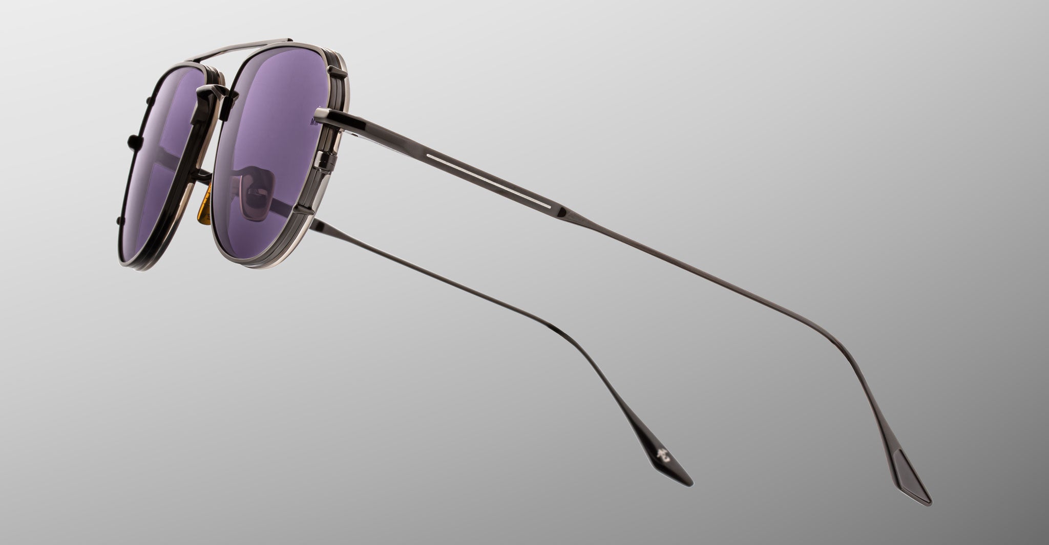 Jacques Marie Mage Cendrars sunglasses with purple-tinted lenses, front view.