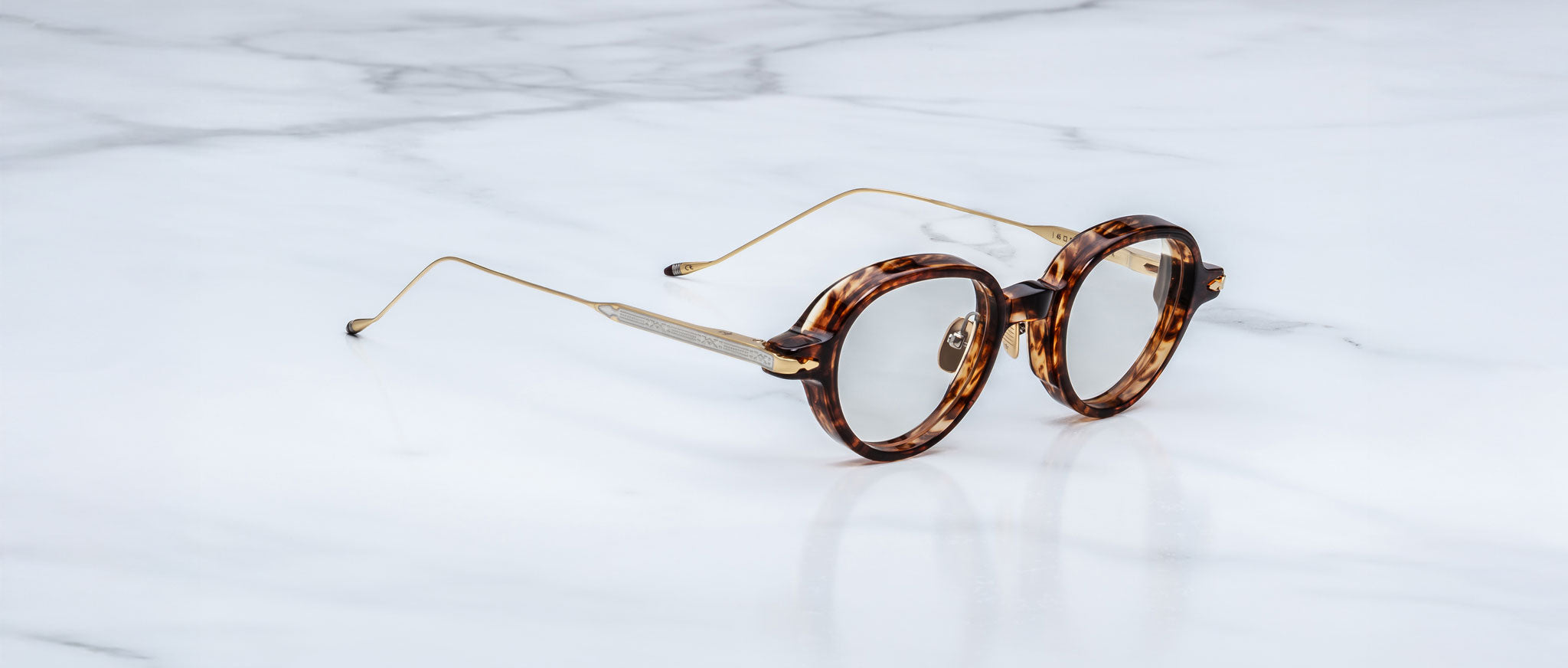 Jacques Marie Mage The Clark round tortoiseshell eyeglasses with thin gold temples, front view.