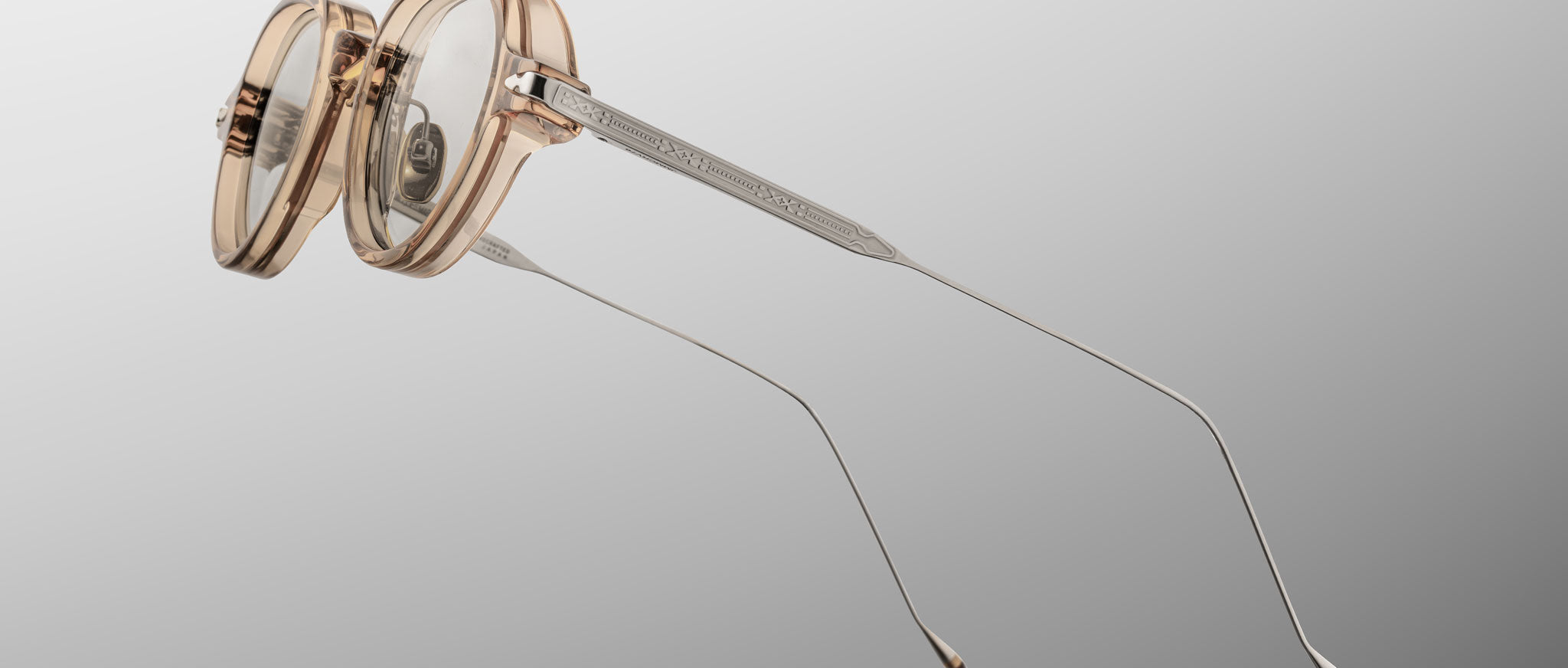 Jacques Marie Mage The Clark eyeglasses, transparent frame, thin metal arms, front view.