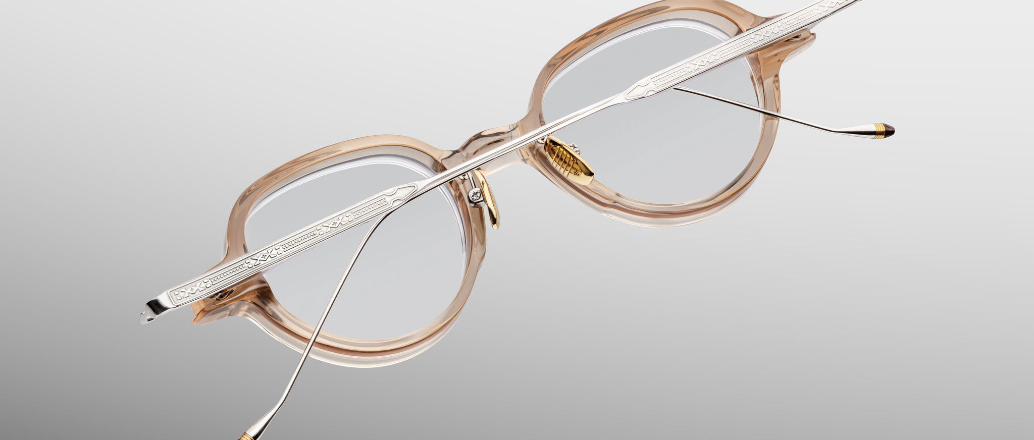 Jacques Marie Mage The Clark eyeglasses, translucent beige frames with metal arms, rear view.
