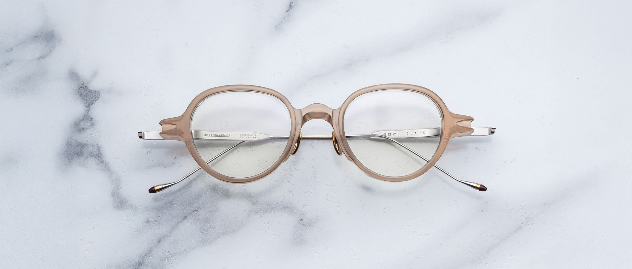 Jacques Marie Mage The Clark round taupe eyeglasses with clear lenses, top view.