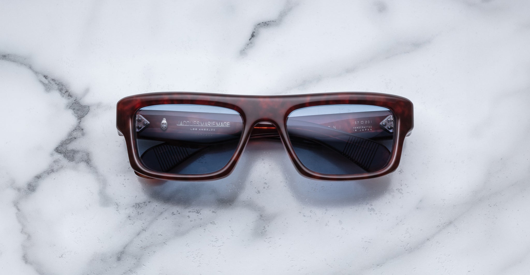 Jacques Marie Mage Cleavon 57 dark tortoiseshell sunglasses with bold frames, viewed from above.