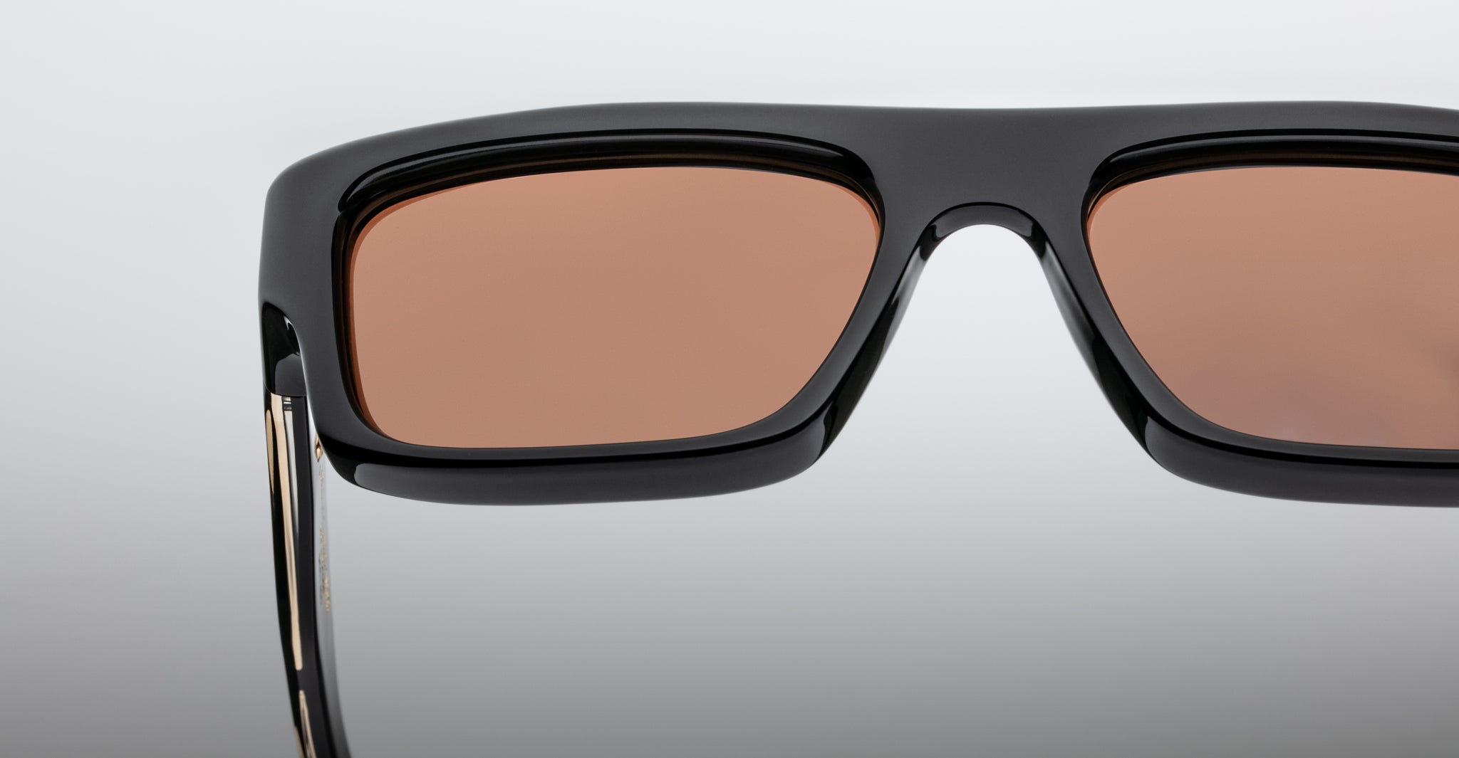 Jacques Marie Mage Cleavon 57 sunglasses, black rectangular frame with brown-tinted lenses, shown from a front angle.