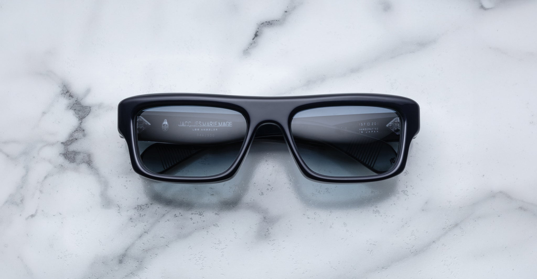 Jacques Marie Mage Cleavon 57 rectangular sunglasses with UV-protected dark lenses, top-down view.