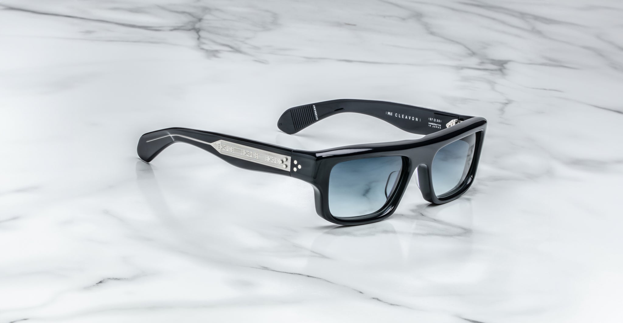 Jacques Marie Mage Cleavon 57 black rectangular sunglasses with UV protection and metallic accents, front view.