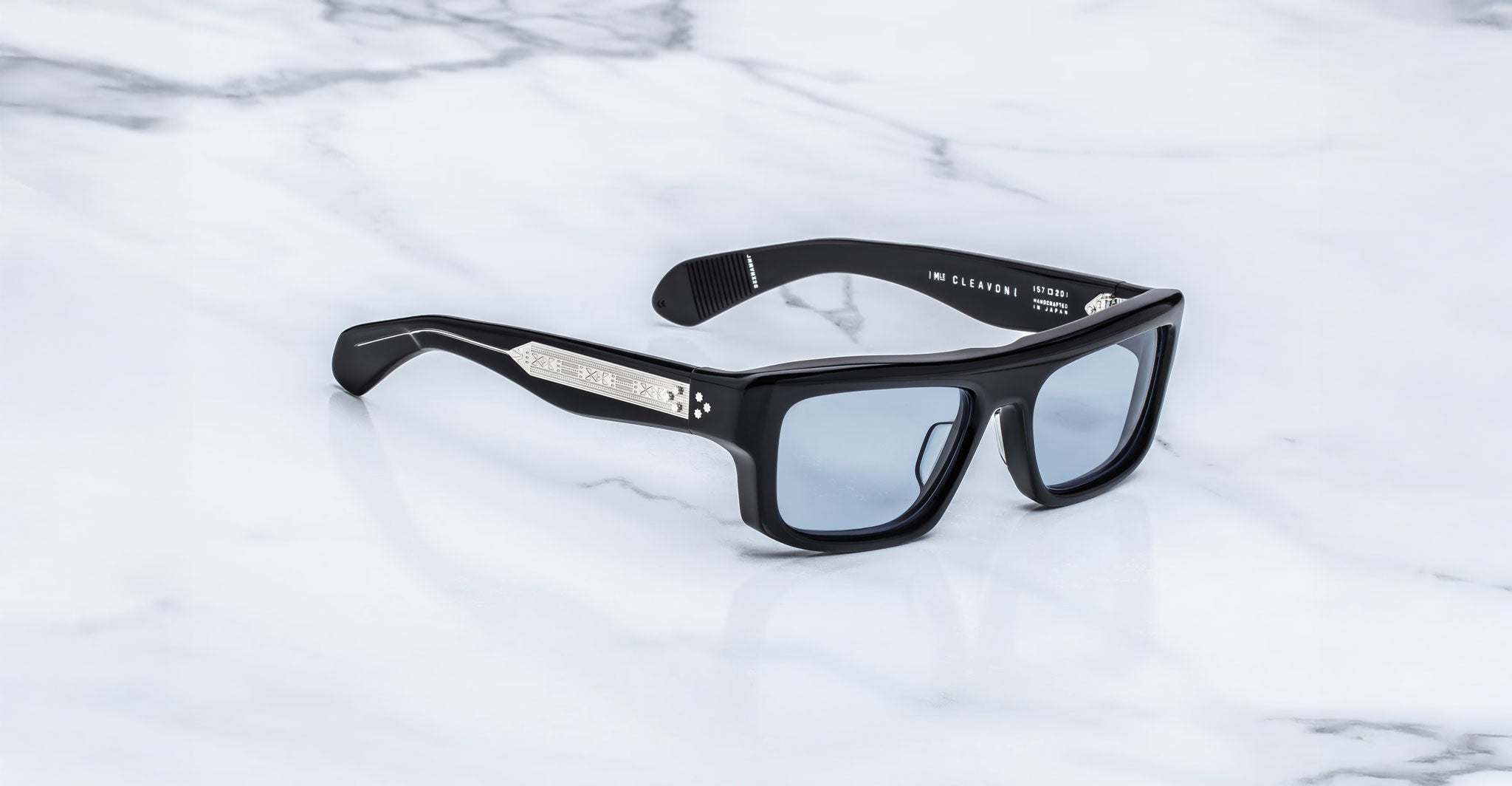Jacques Marie Mage Cleavon 57 black rectangular sunglasses with silver temples, viewed from above.
