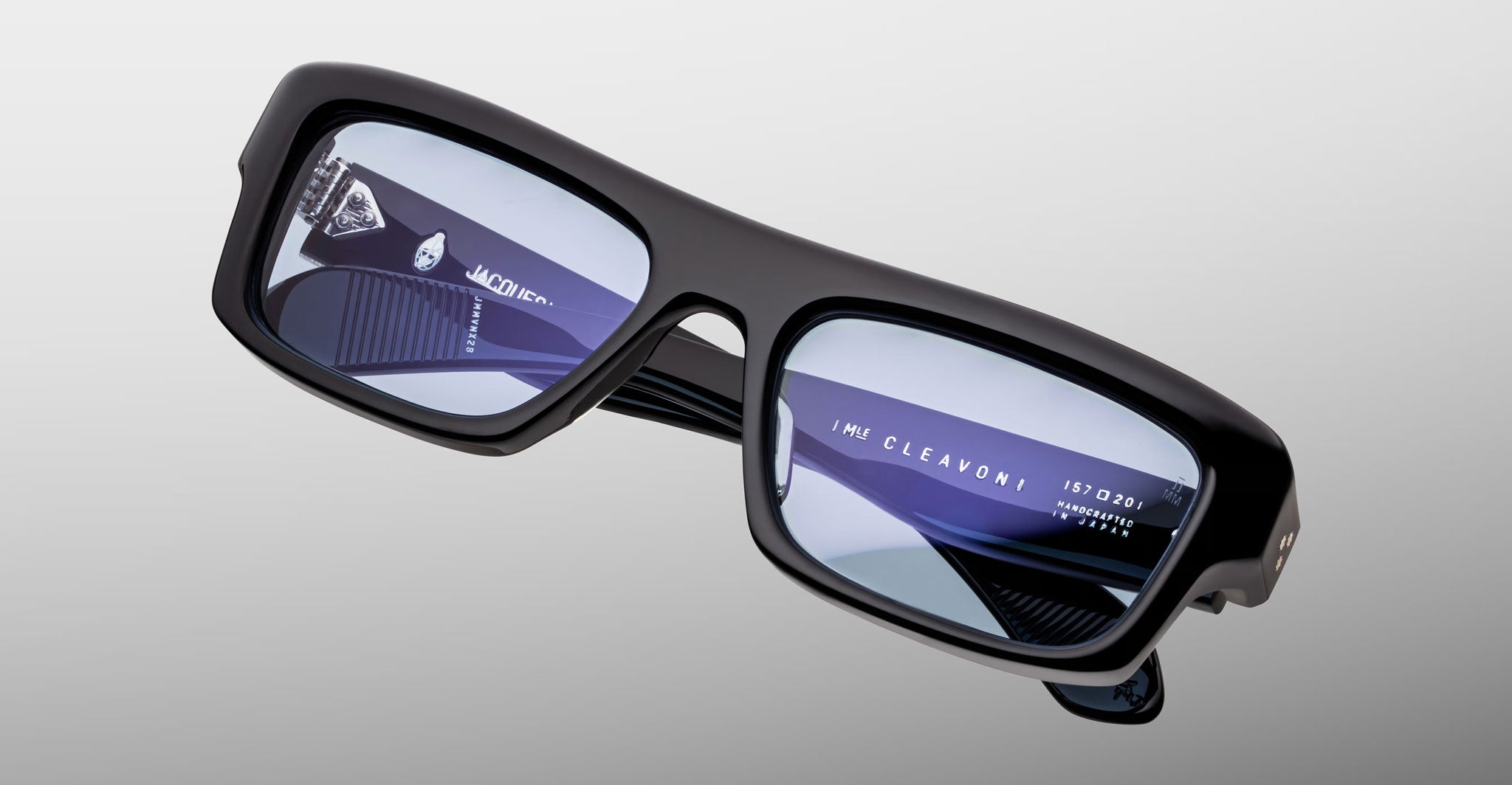 Jacques Marie Mage Cleavon 57 black rectangular eyeglasses with reflective lenses and subtle branding, front view.