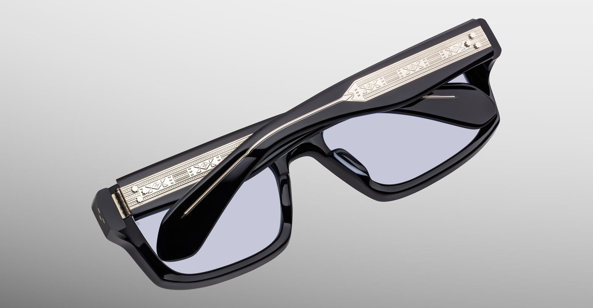 Jacques Marie Mage Cleavon 57 black sunglasses with thick frames and metallic top accents, shown from the front angle.